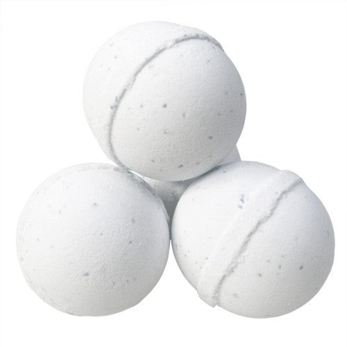 White bath bombs in a sleep aid relaxation kit gift set for calming and soothing bath experience
