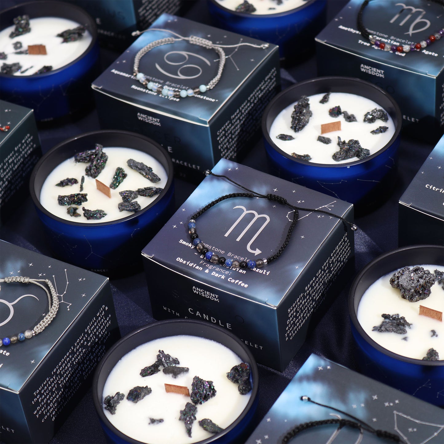 Scorpio zodiac crystal candle by Samsara Wellbeing with black crystals in a blue container and matching bracelet