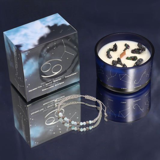 Cancer zodiac crystal candle by Samsara Wellbeing with crystals and constellation design in blue glass jar