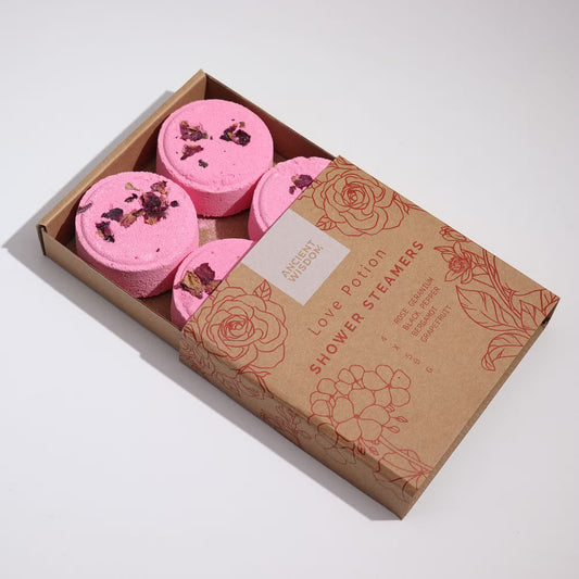 Samsara Wellbeing pink Zen shower steamers with dried petals in a brown floral printed box