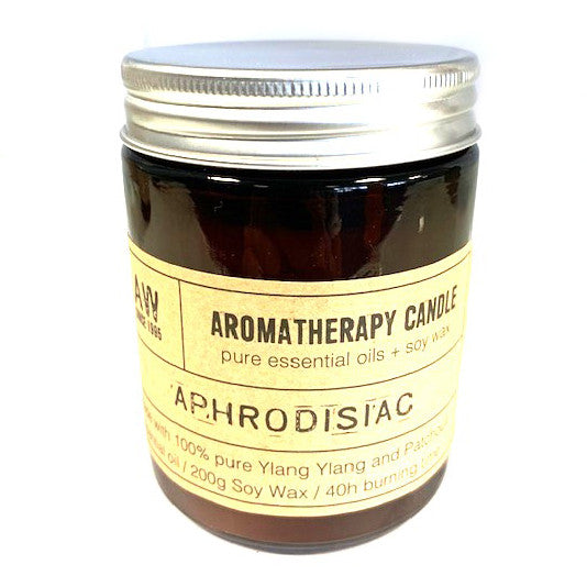 Aphrodisiac aromatherapy peace candle in brown glass jar with silver lid and natural label