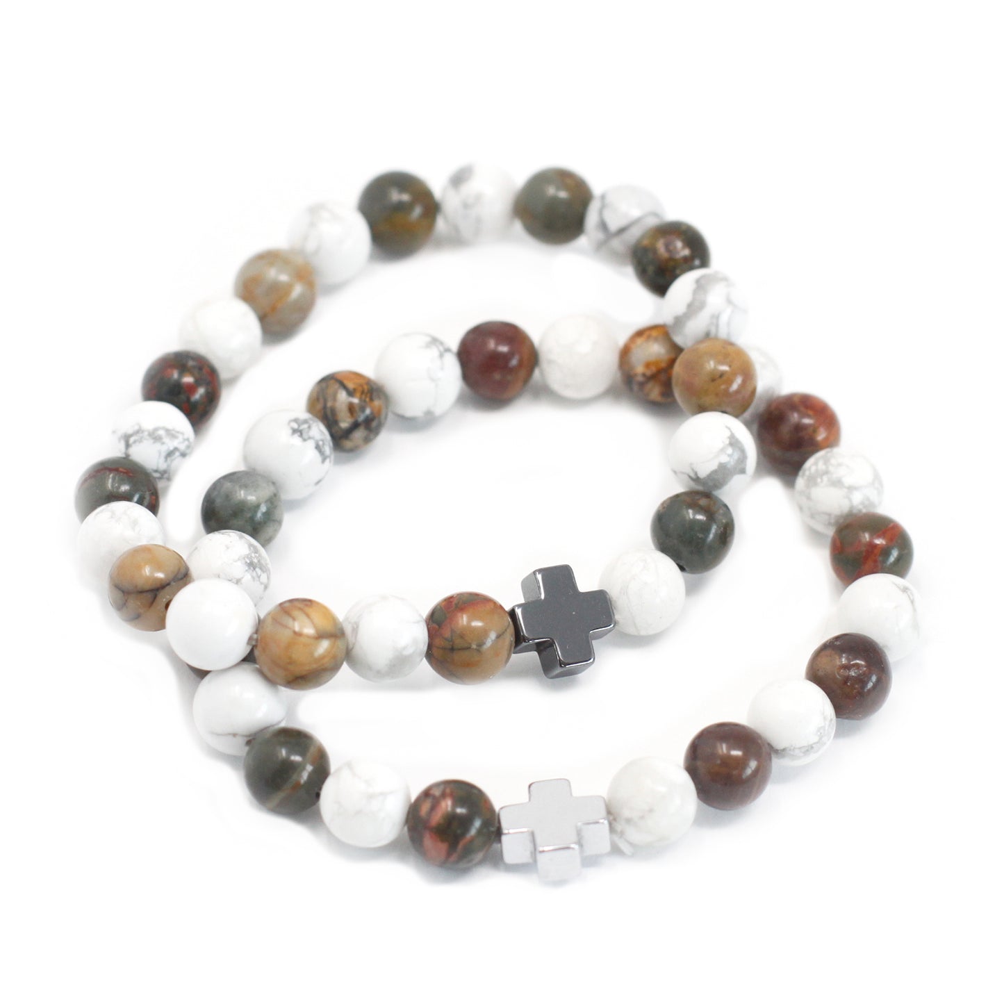 Gemstone friendship bracelets set with multicolored beads and silver cross charms on white background