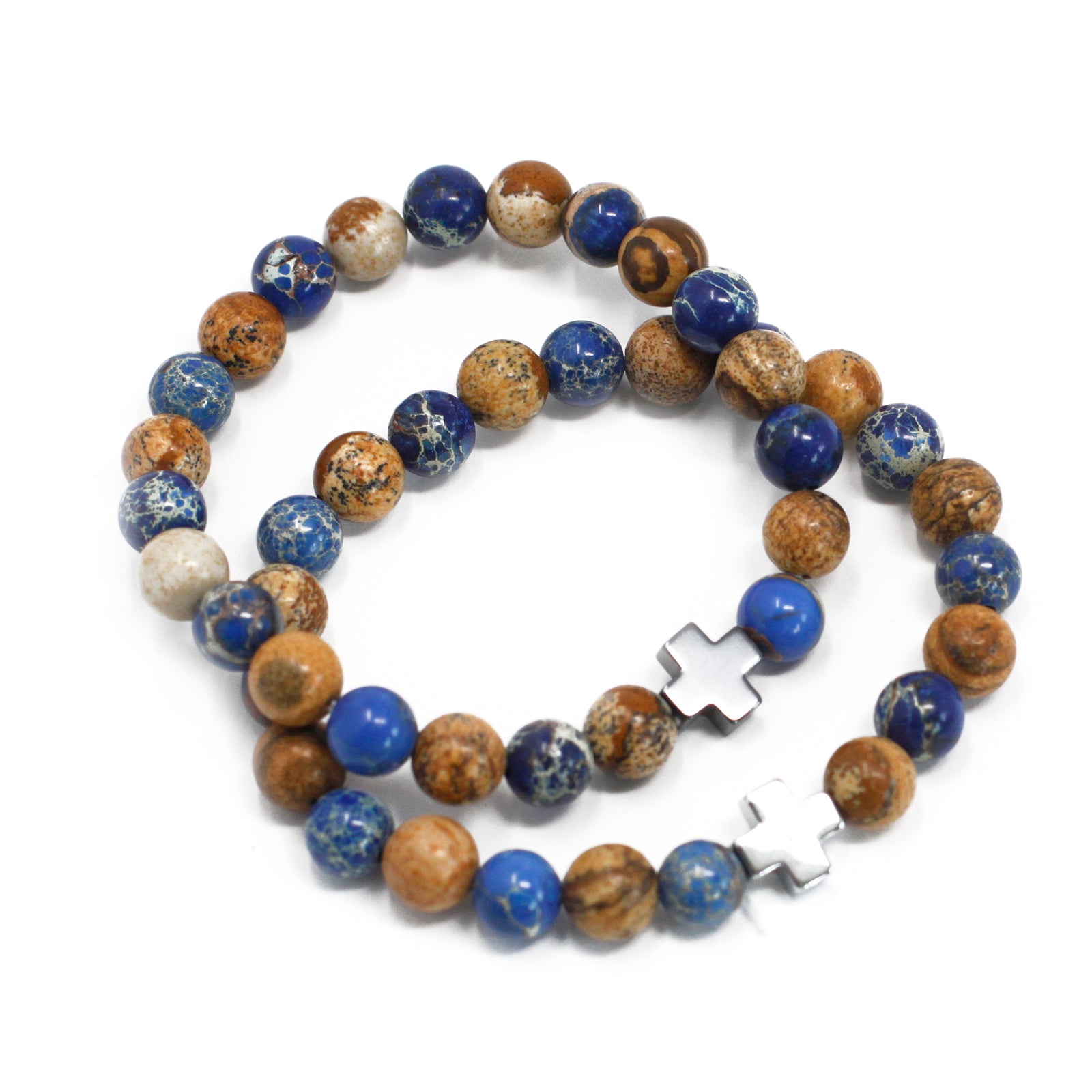 Gemstone friendship bracelets set with blue and brown beads and silver cross charms on white background