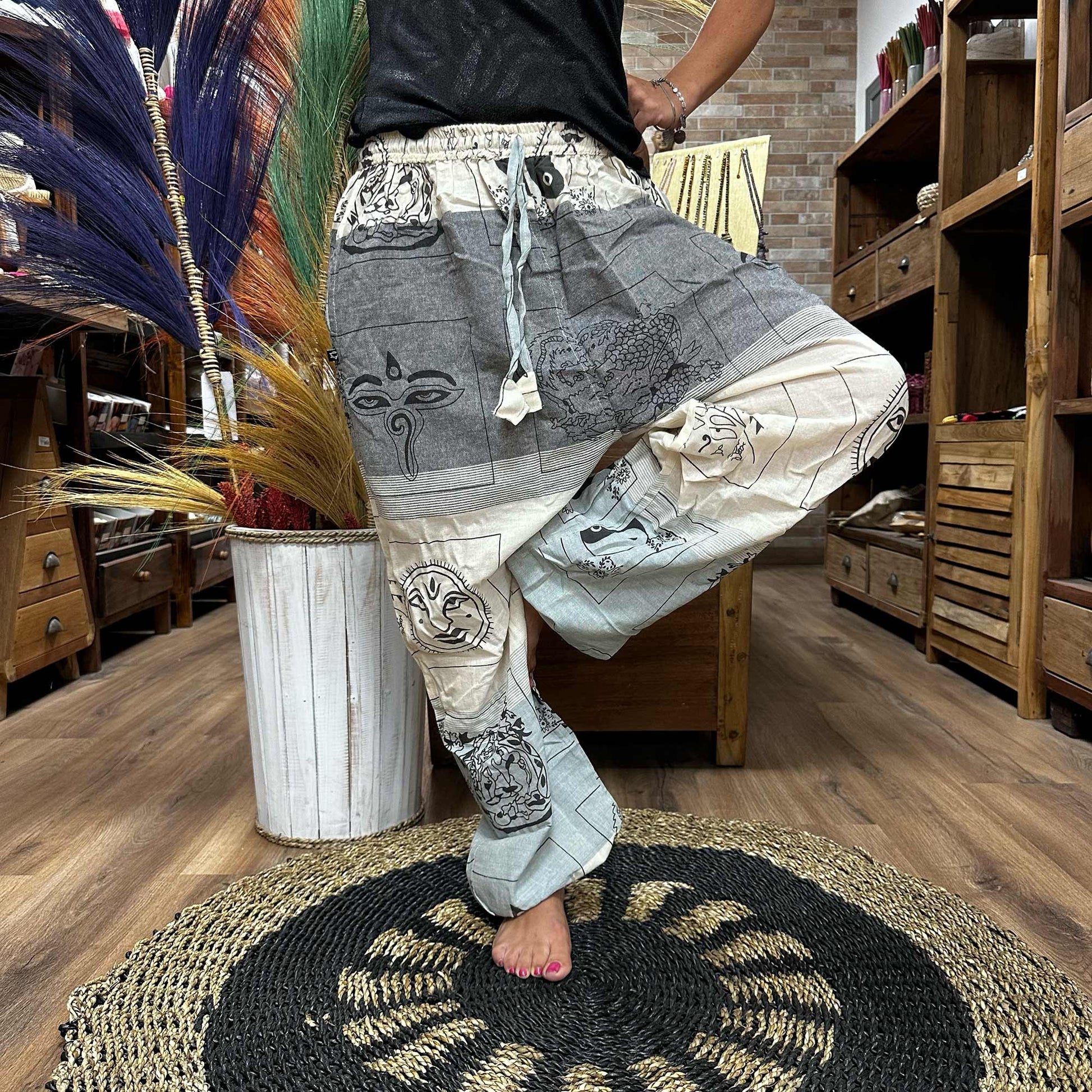 Samsara Wellbeing Himalayan yoga pants in grey and cream with spiritual prints and drawstring waist
