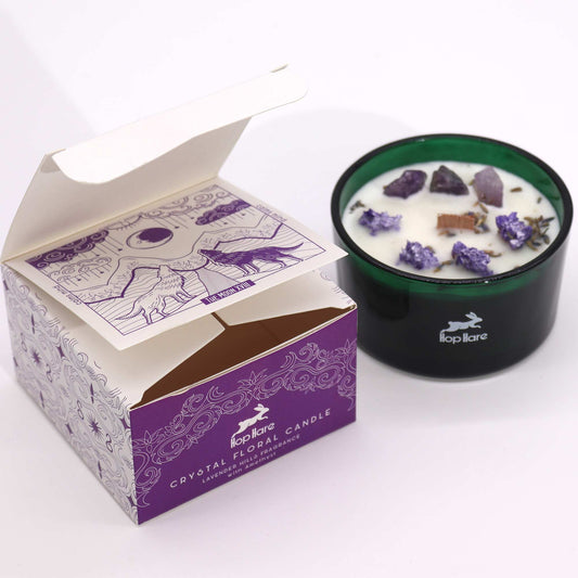 Crystal infused flower candle in green glass jar with lavender and amethyst crystals and decorative purple box