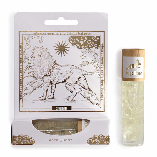 Tarot inspired roll on oil with rock quartz crystals in a clear glass bottle and decorative packaging
