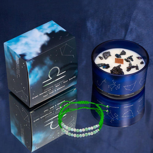 Libra zodiac crystal candle by Samsara Wellbeing with constellation design and crystal stones in dark blue glass