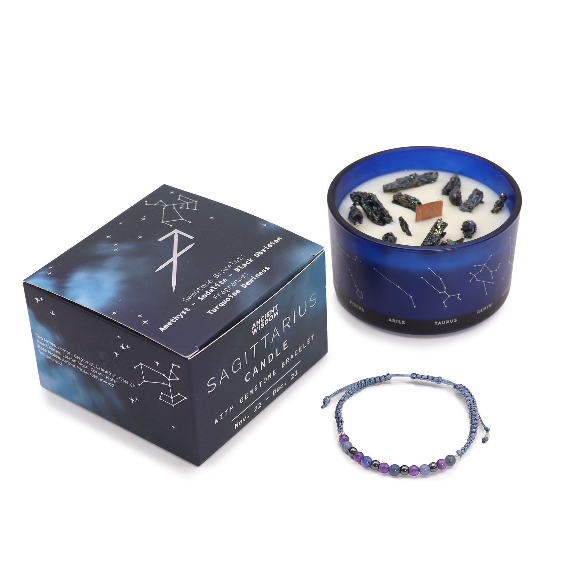 Sagittarius zodiac crystal candle by Samsara Wellbeing with blue glass jar, gemstones, and constellation box