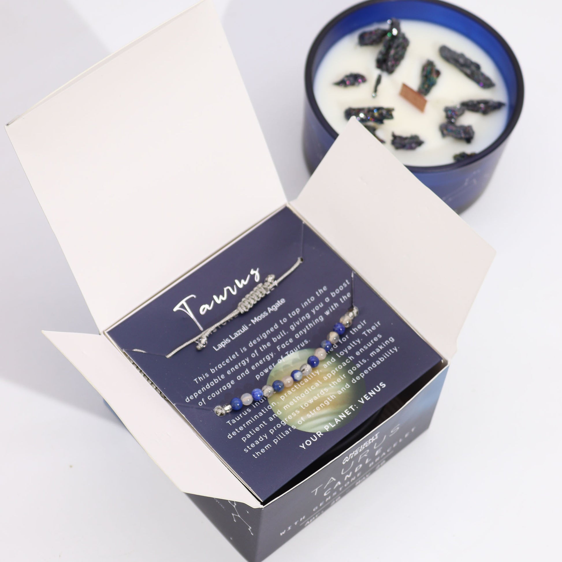 Samsara Wellbeing Taurus zodiac crystal candle in blue glass with black stones and white wax
