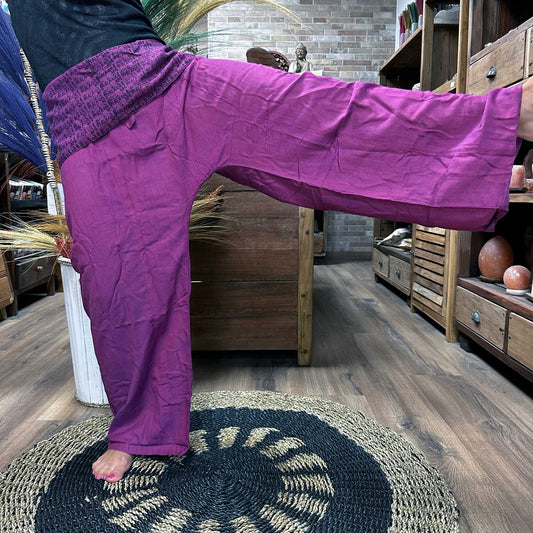 Samsara Wellbeing Thai fisherman pants purple worn indoors showing loose fit and comfortable fabric