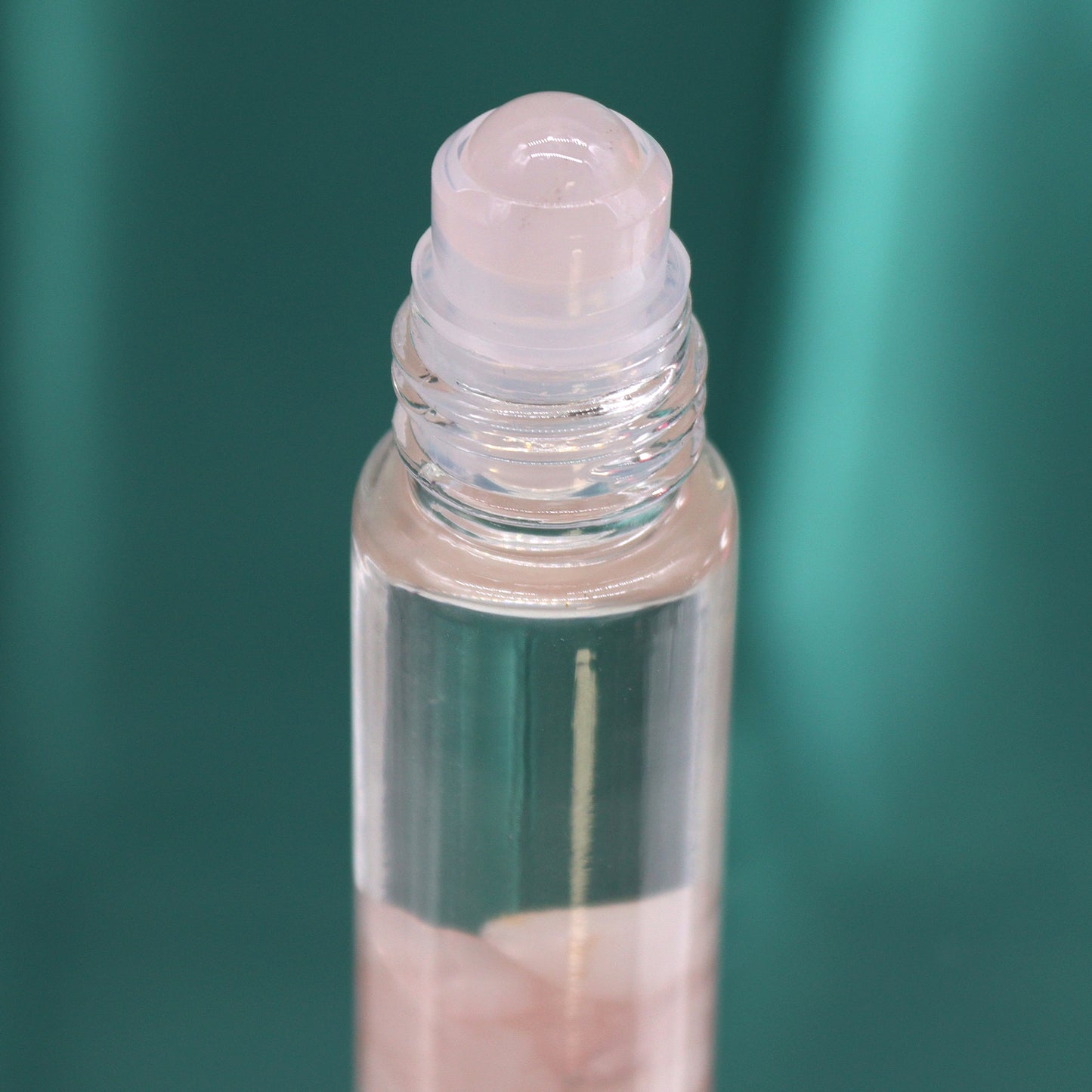 Close-up of the lovers aromatherapy roller essential oil bottle with a clear rollerball top
