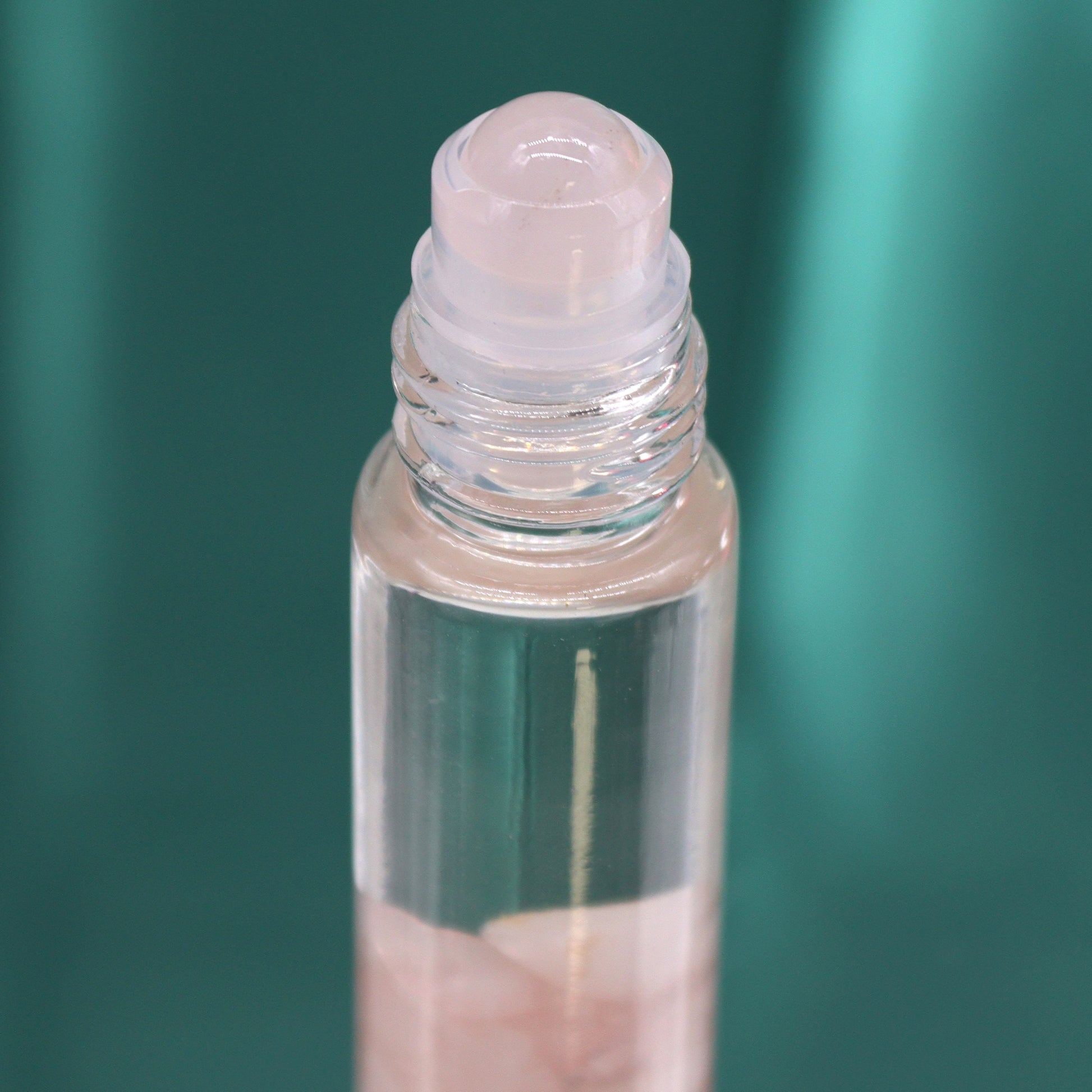 Close-up of the lovers aromatherapy roller essential oil bottle with a clear rollerball top