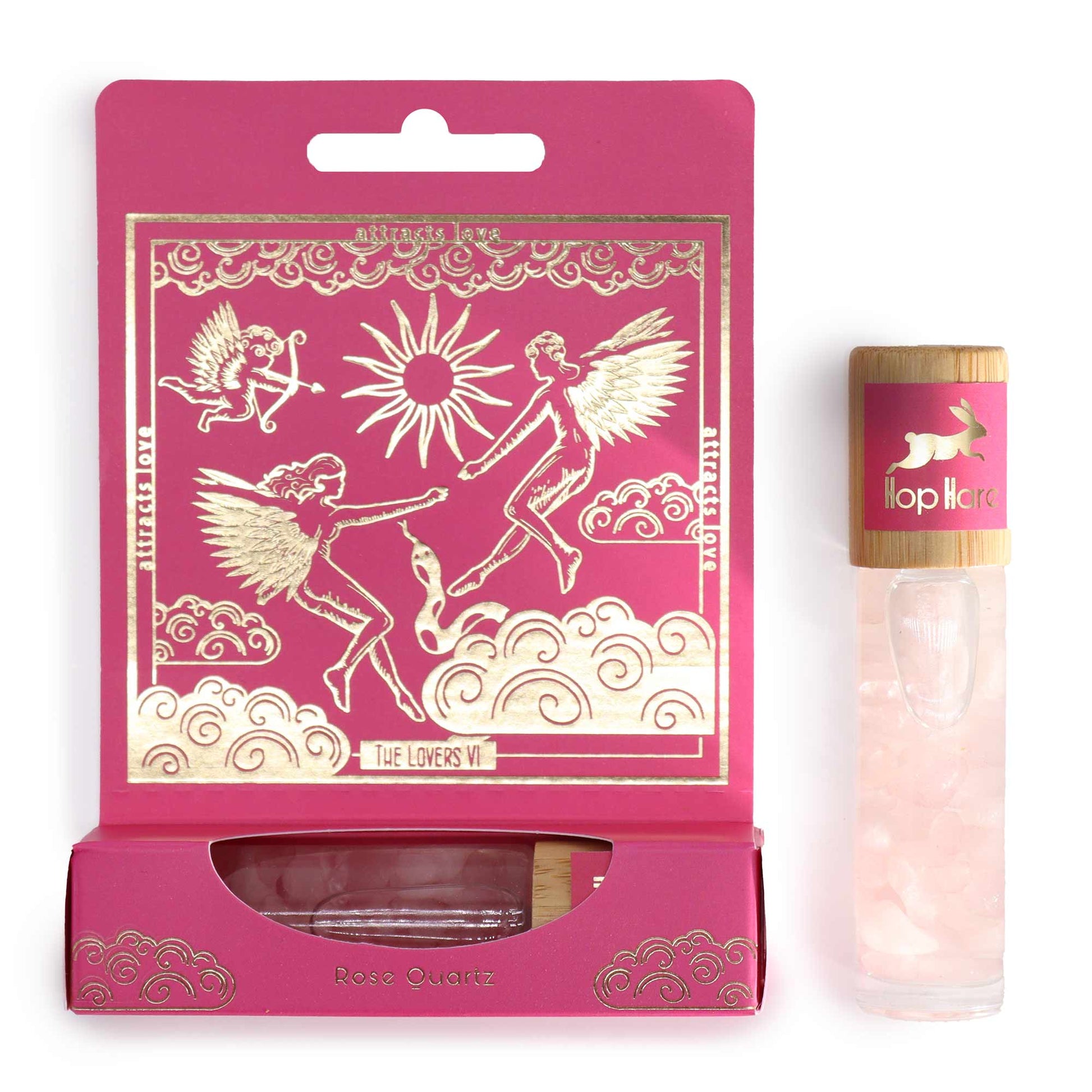 The lovers aromatherapy roller with rose quartz in a pink decorative box featuring angelic illustrations