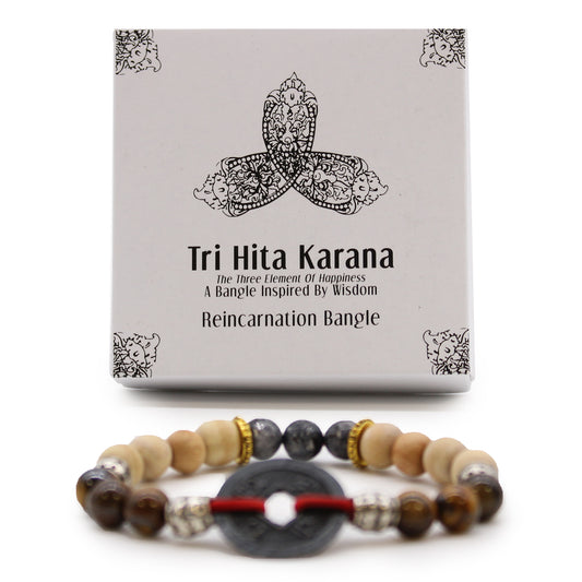 Tri Hita Karana bangle with natural wooden and stone beads beside decorative box from My Store