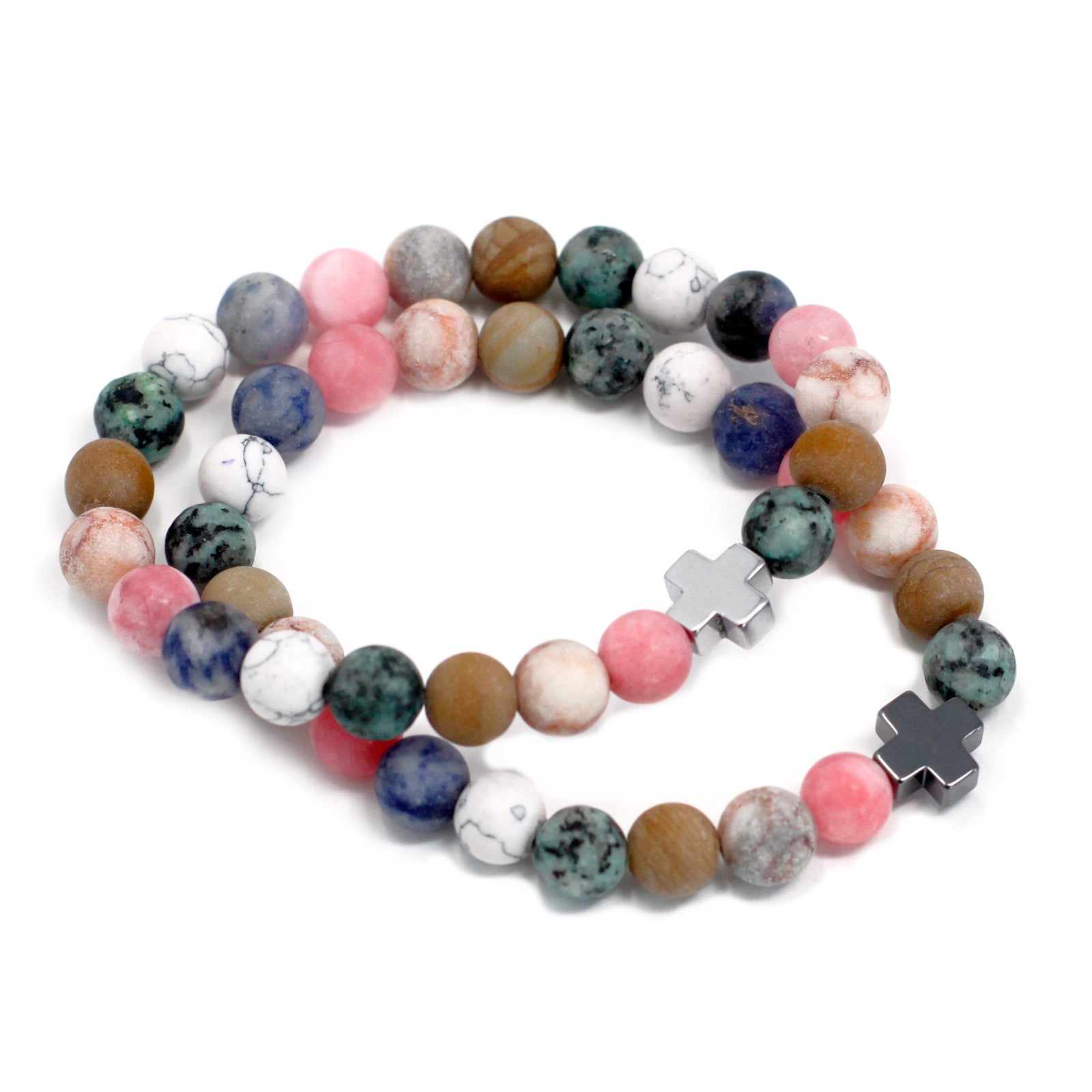 Colourful gemstone friendship bracelets set with round beads and silver cross charms on white background